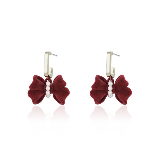 French designer pearl flocked bow earrings