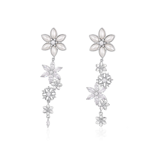 French designer's original snowflake series studded earrings with diamonds