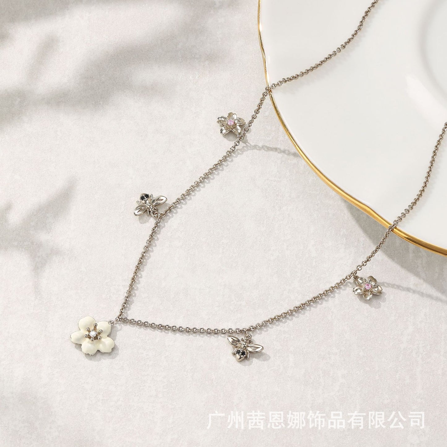 French designer flower and bee necklace