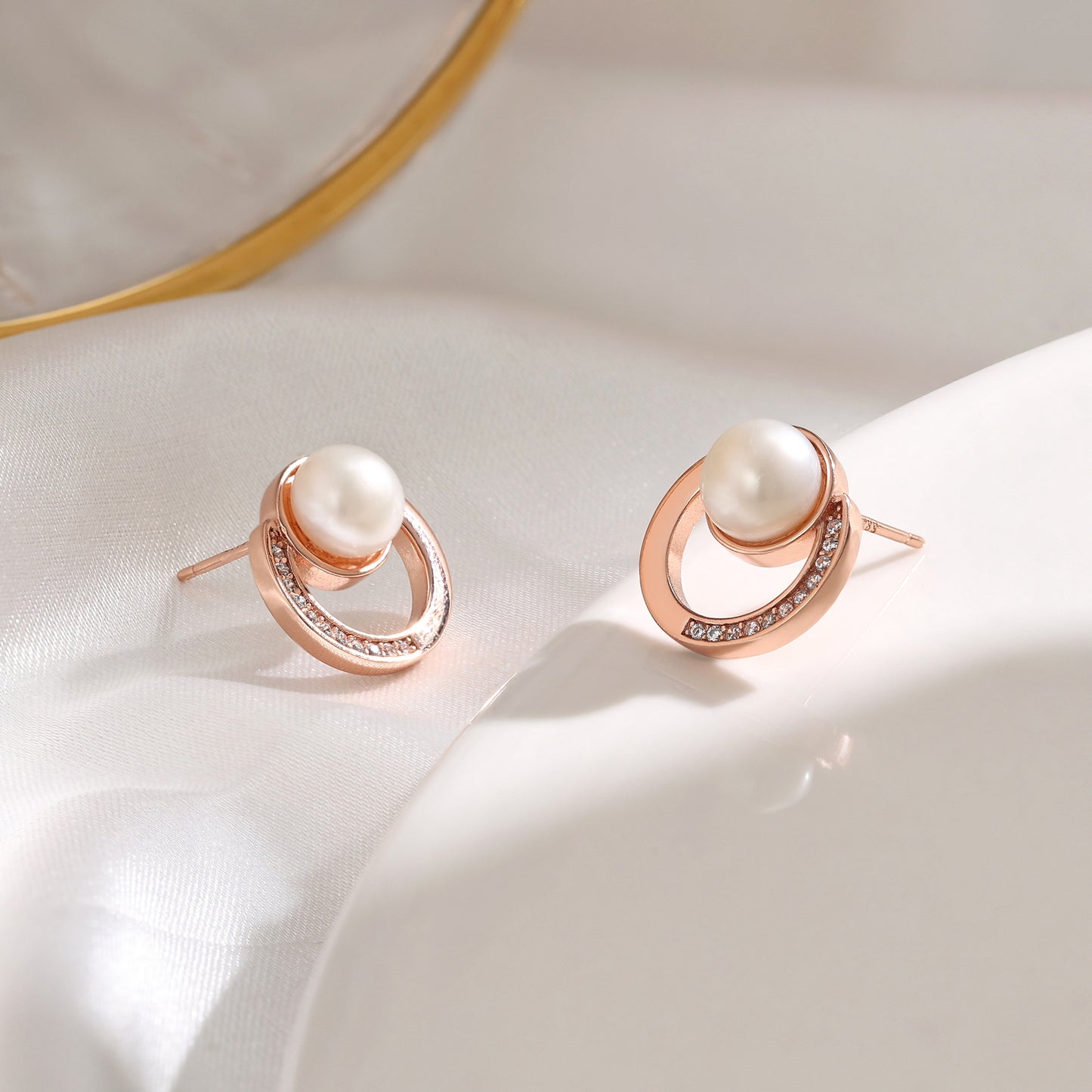 French designer's time-traveling series of natural pearl and diamond stud earrings