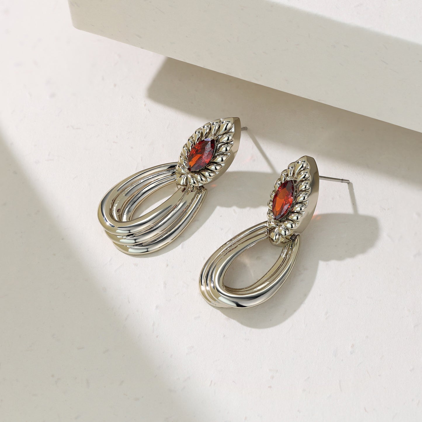 French designer's original geometric drop-set red zircon earrings