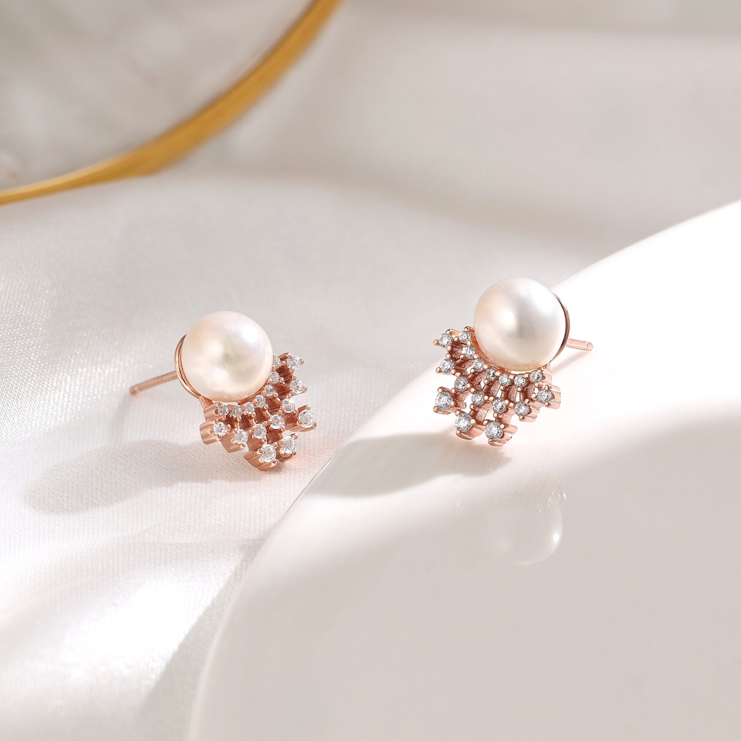 French designer's time-traveling series of natural pearl and diamond stud earrings