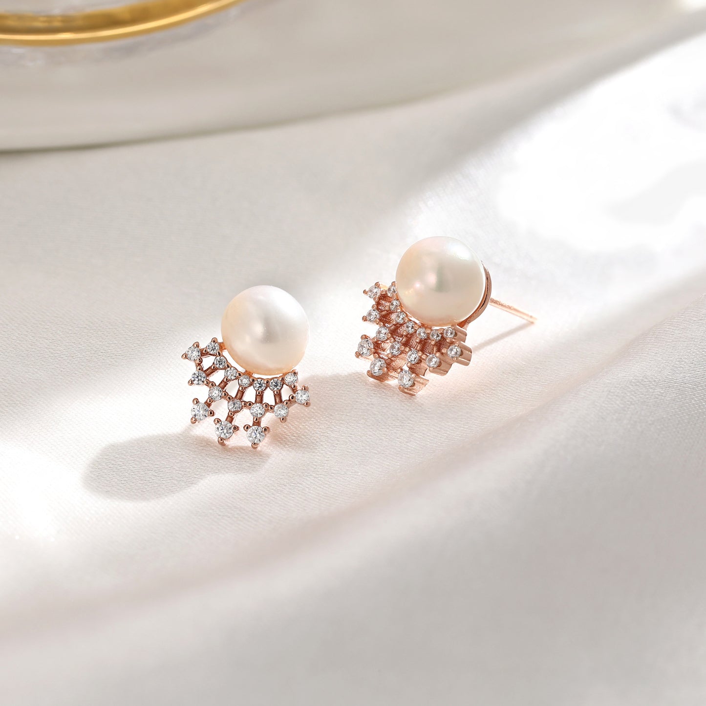 French designer's time-traveling series of natural pearl and diamond stud earrings