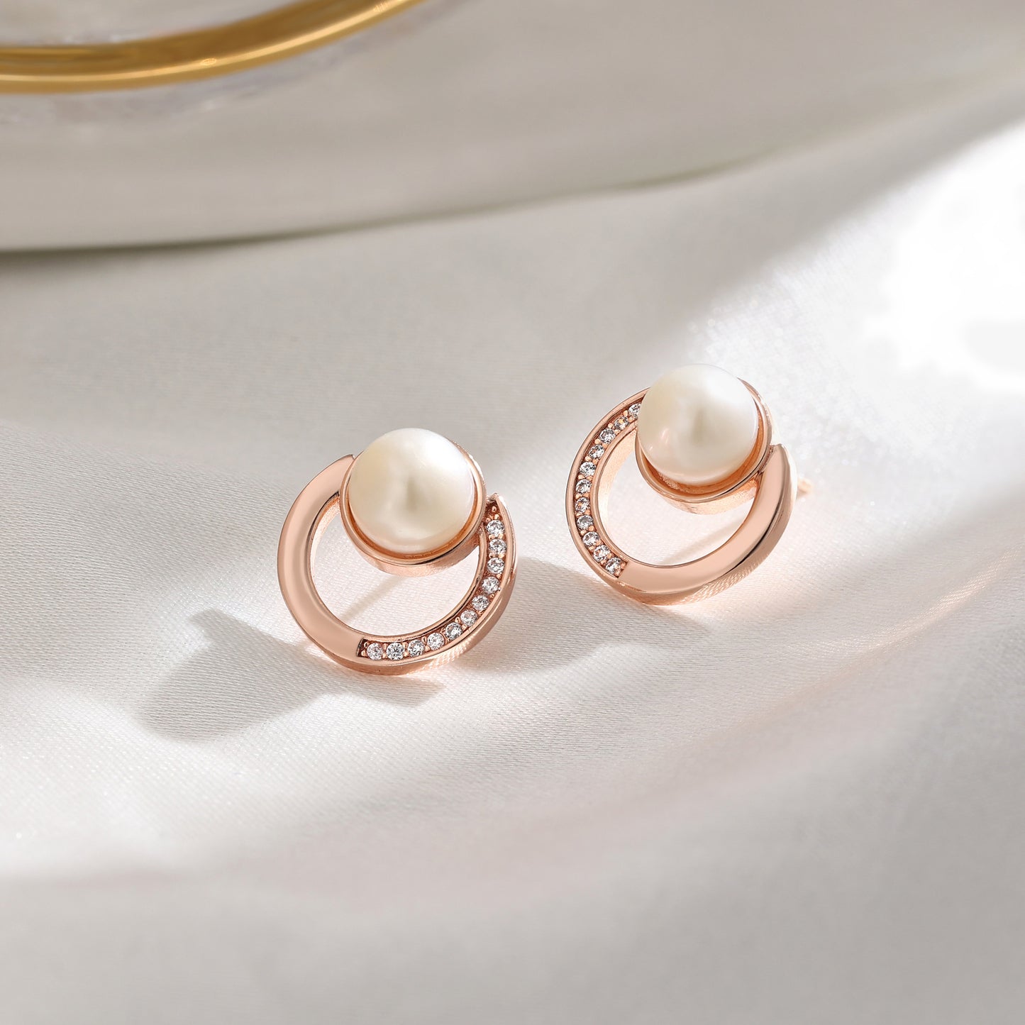 French designer's time-traveling series of natural pearl and diamond stud earrings