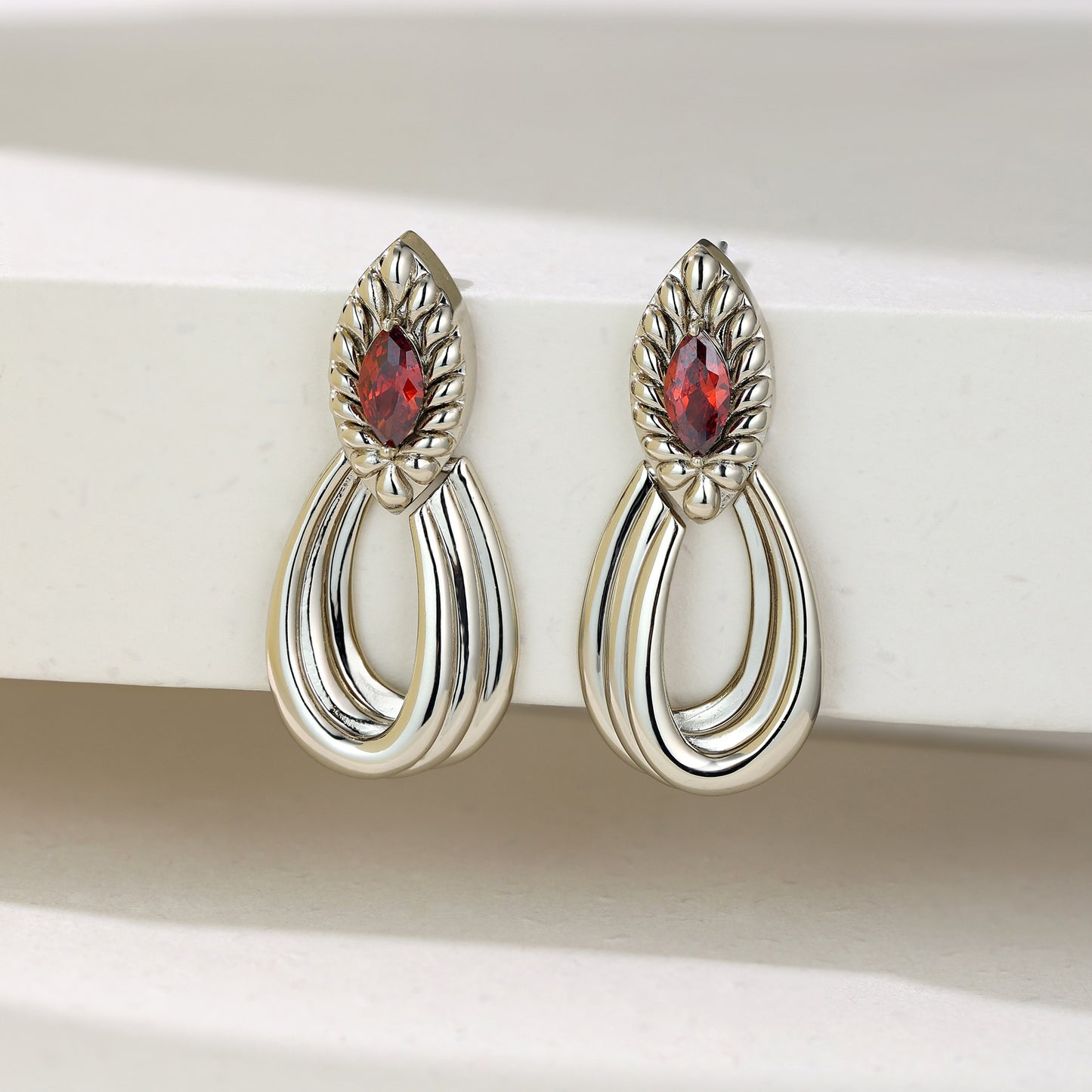 French designer's original geometric drop-set red zircon earrings