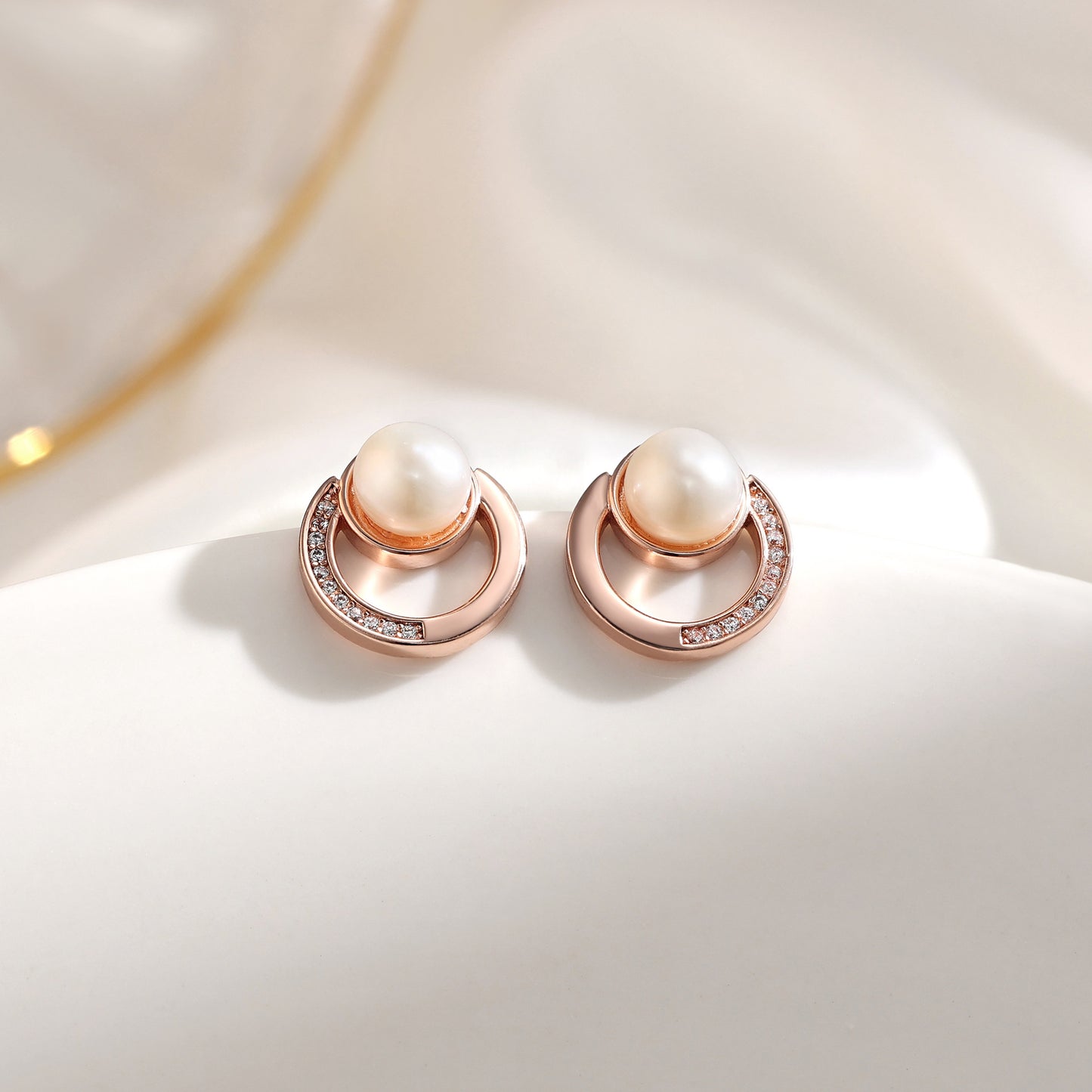 French designer's time-traveling series of natural pearl and diamond stud earrings