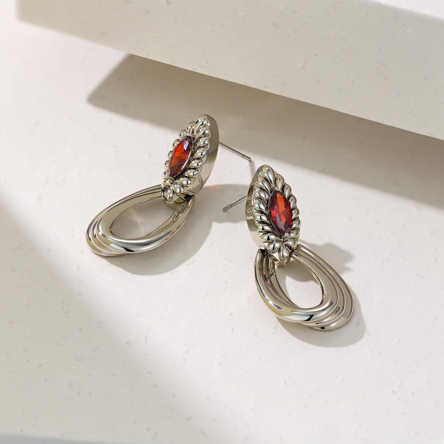 French designer's original geometric drop-set red zircon earrings