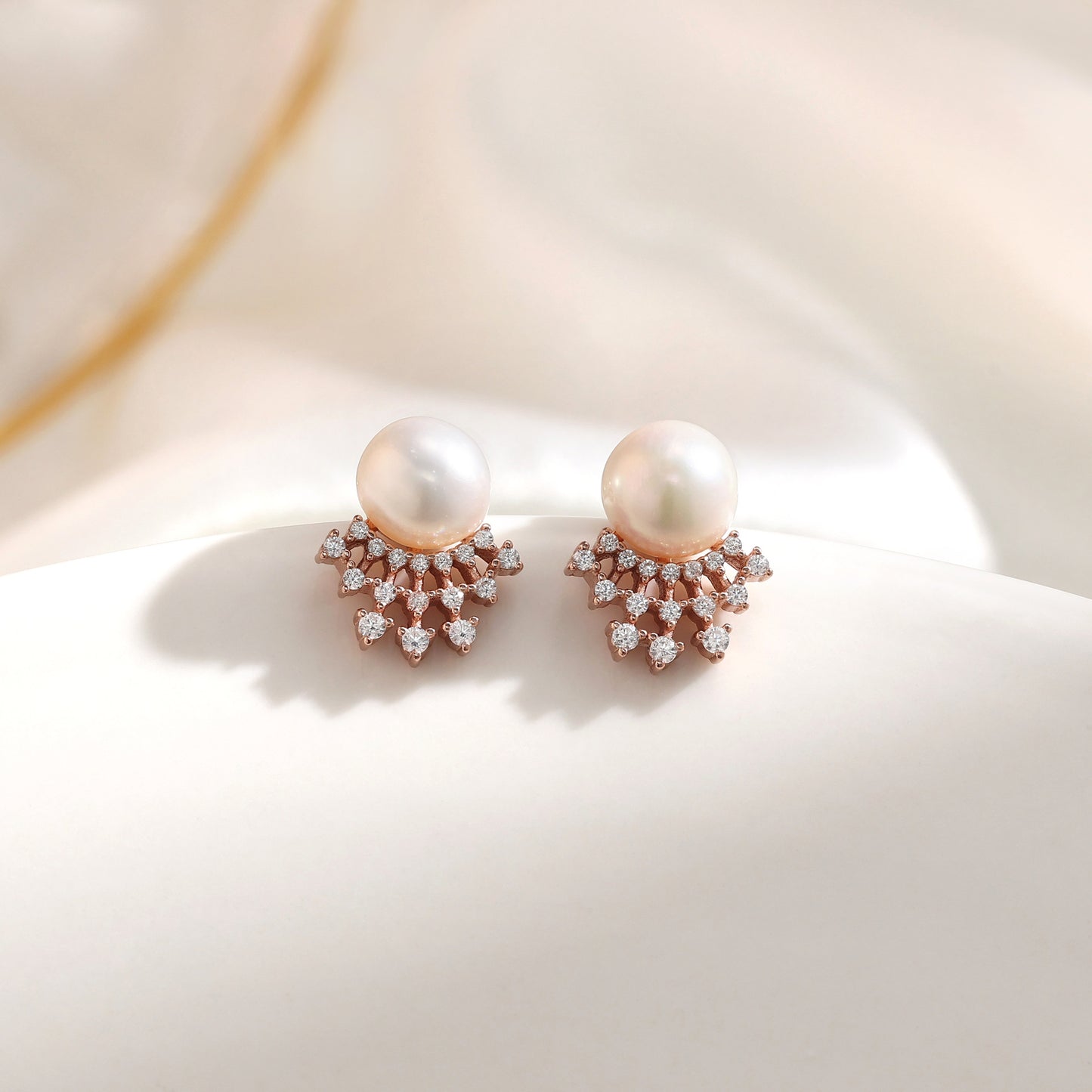 French designer's time-traveling series of natural pearl and diamond stud earrings