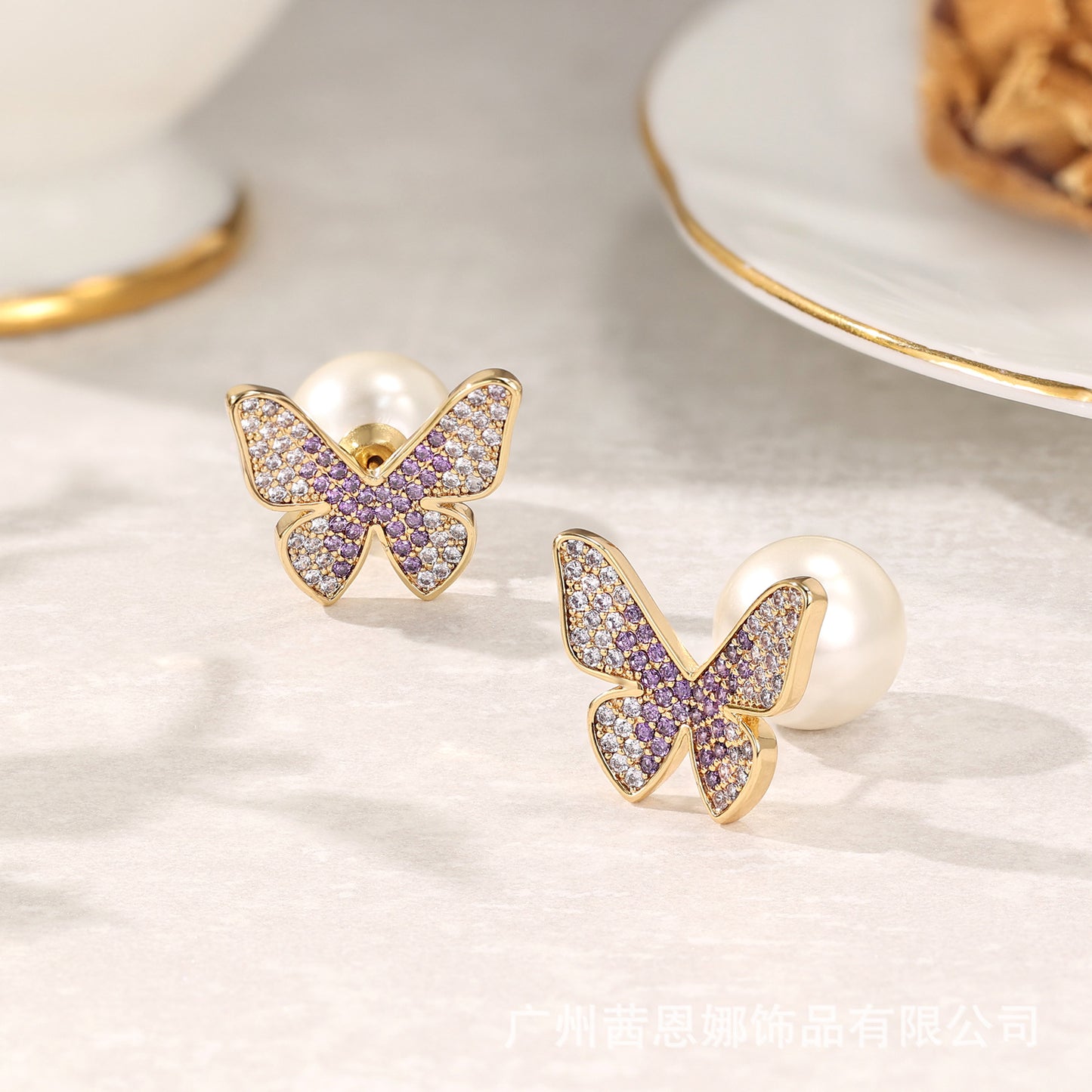 Greek designer butterfly stud earrings with purple zircon