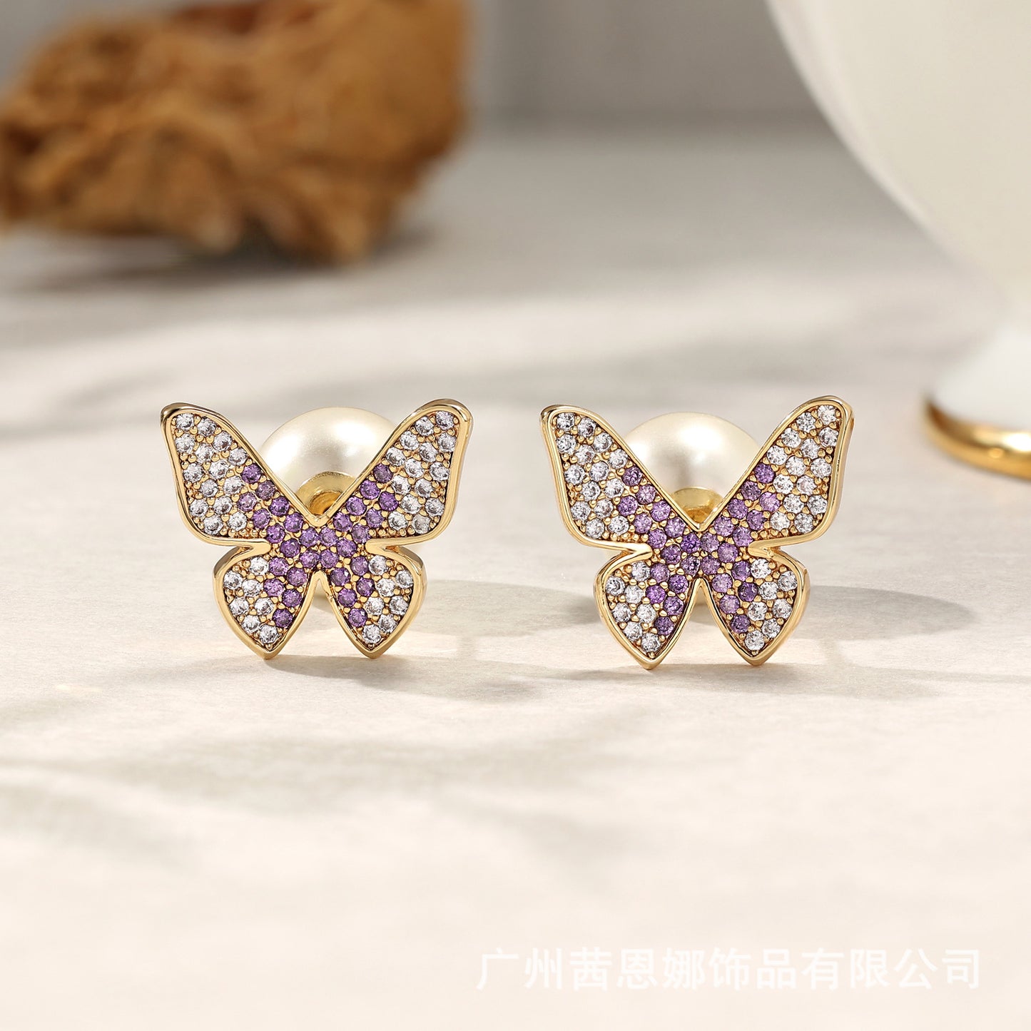 Greek designer butterfly stud earrings with purple zircon